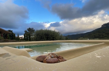 Sand effect pool coating with natural beach look